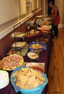 Kathe Hayes arranges food at the NMA/CO fundraiser at the Sunflower Theatre in Cortez.